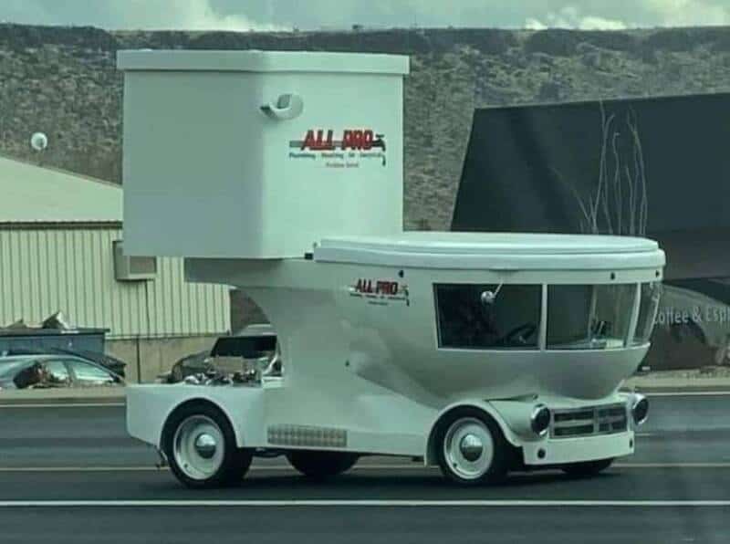 Unique food truck designed to look like a giant fast-food container on wheels.
