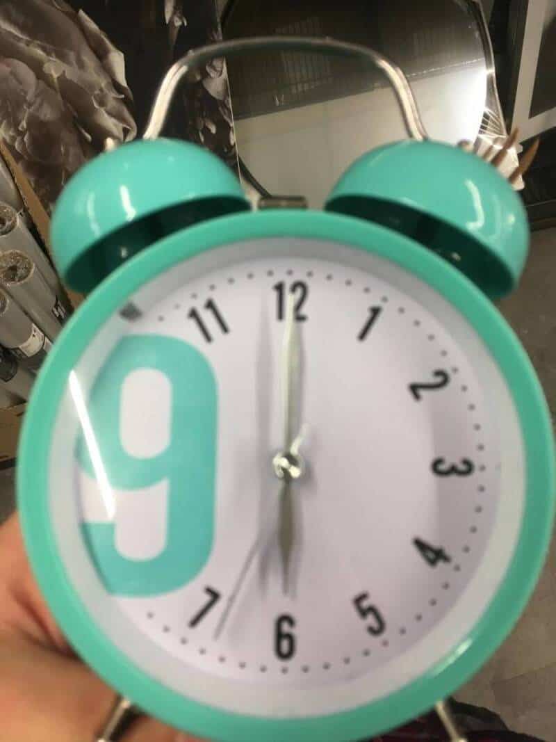 Alarm clock with a large number 9 and a playful design, perfect for funny random pictures collection.