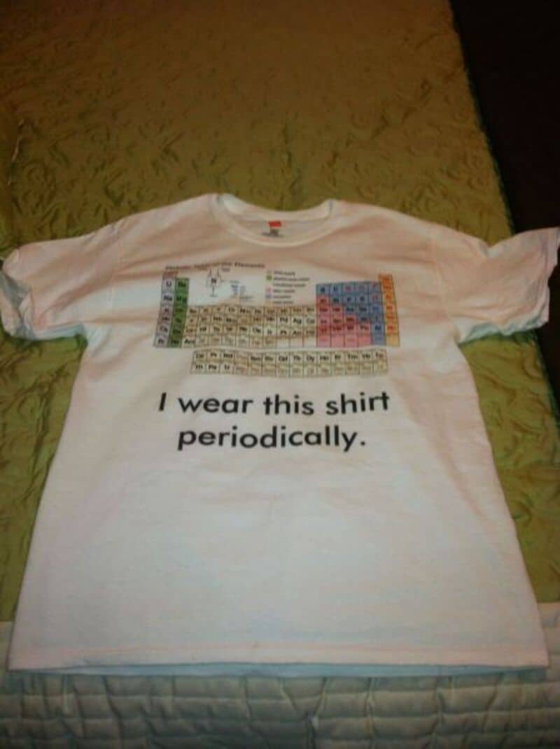 White T-shirt featuring a periodic table chart and the phrase "I wear this shirt periodically".