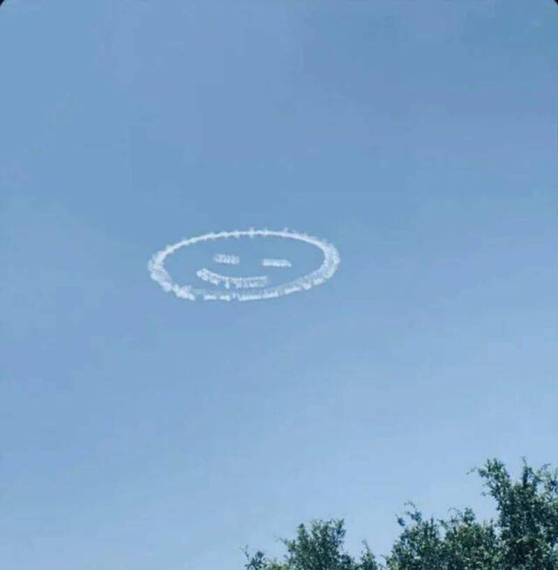 Cloud formation creating a smiley face in the sky.