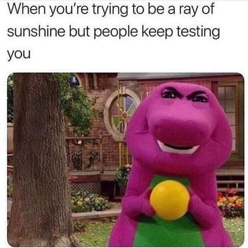 Barney the Dinosaur holding a yellow ball with a humorous caption about testing patience.