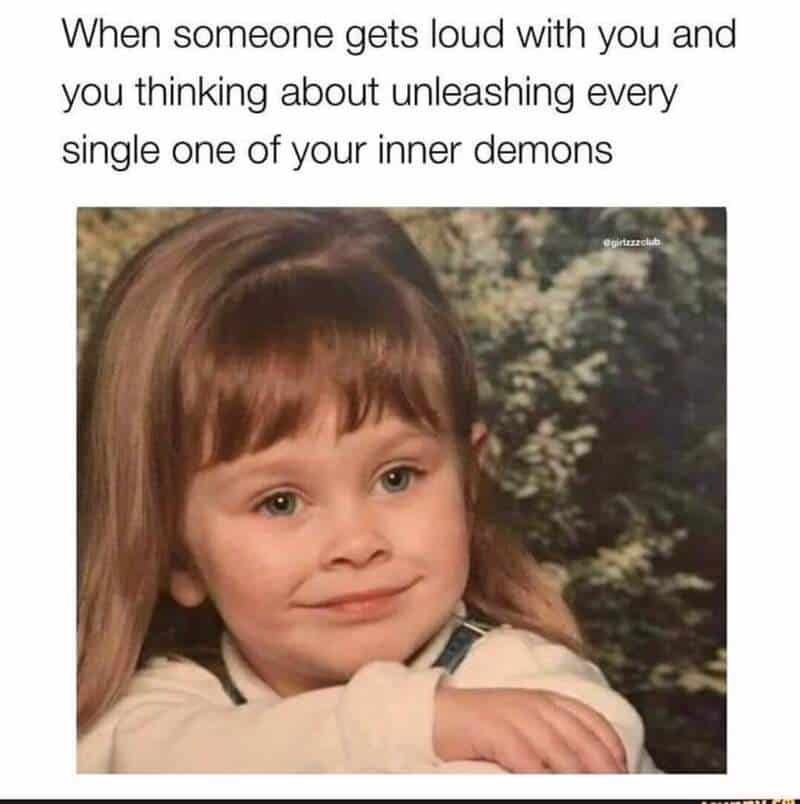 Funny girl with a smirk, expressing inner demons in a humorous meme.