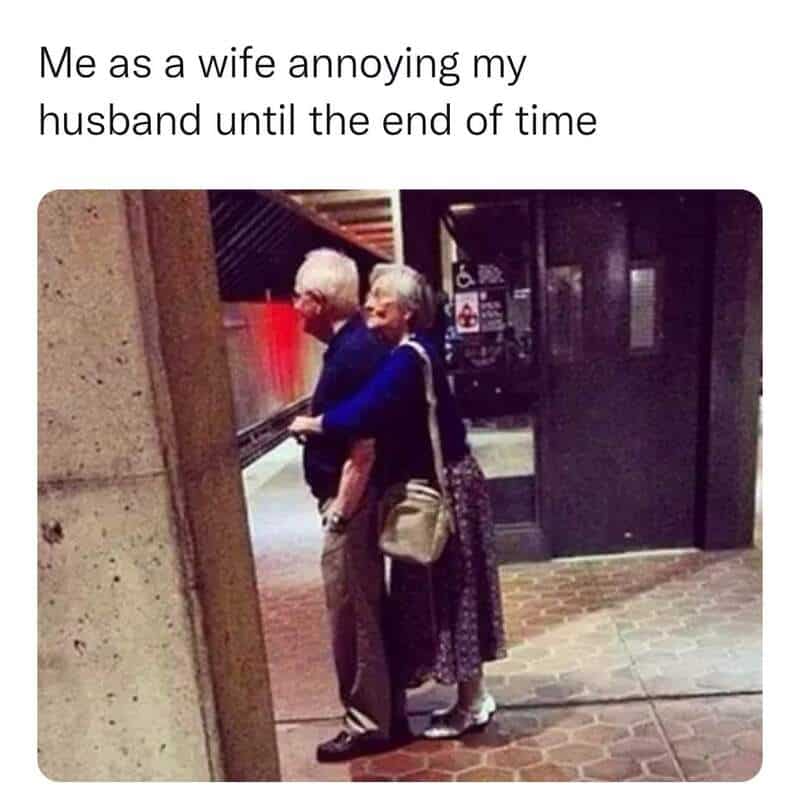 Elderly woman hugging her husband at an elevator door, humorous relationship meme.