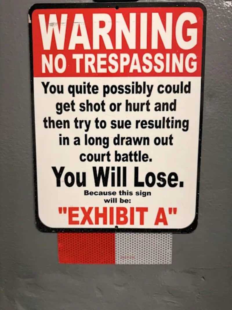 Warning No Trespassing Sign with humorous message about legal consequences.