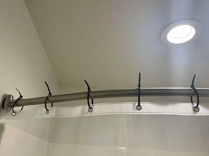 Clothes hanging rod installed incorrectly, causing it to fall and damage the ceiling. A humorous exa.