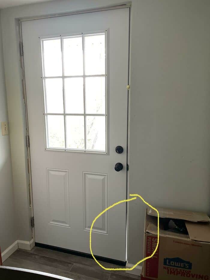 Door with damaged bottom edge and poor sealing, illustrating a home improvement mistake.