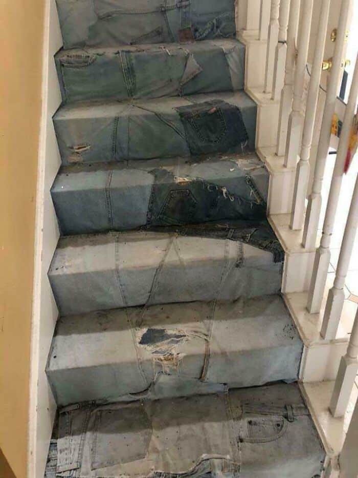 Staircase covered with ripped jeans pattern, mimicking worn-out denim fabric.