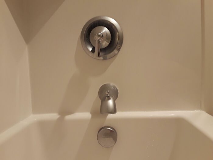 Bathroom faucet with missing handle, part of a home improvement fail.