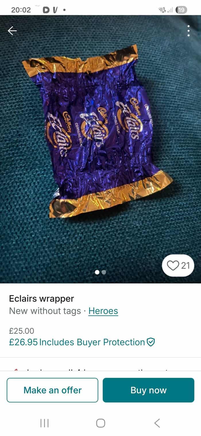 Colorful Eclairs wrapper with purple, gold, and blue design on textured surface.