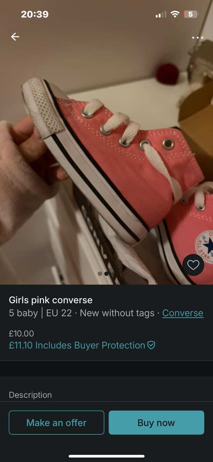 Pink Converse kids' sneakers with white laces and rubber soles, perfect for casual wear and active p.