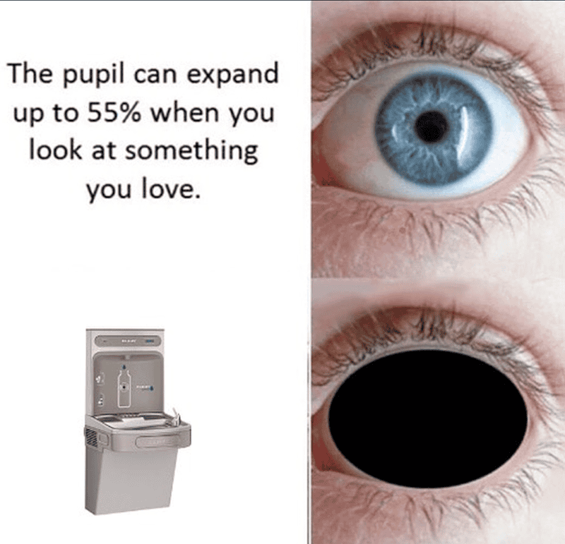 Close-up of a blue eye with pupil dilation and a water fountain, highlighting eye health and vision.