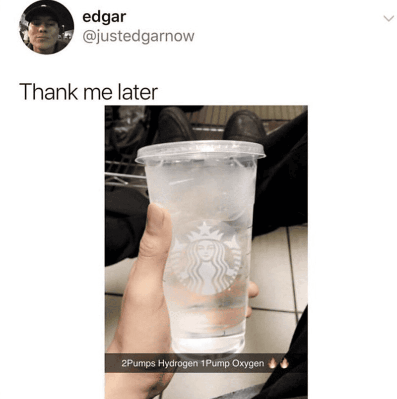 Hand holding a Starbucks cup filled with clear hydrogen water, promoting health benefits.