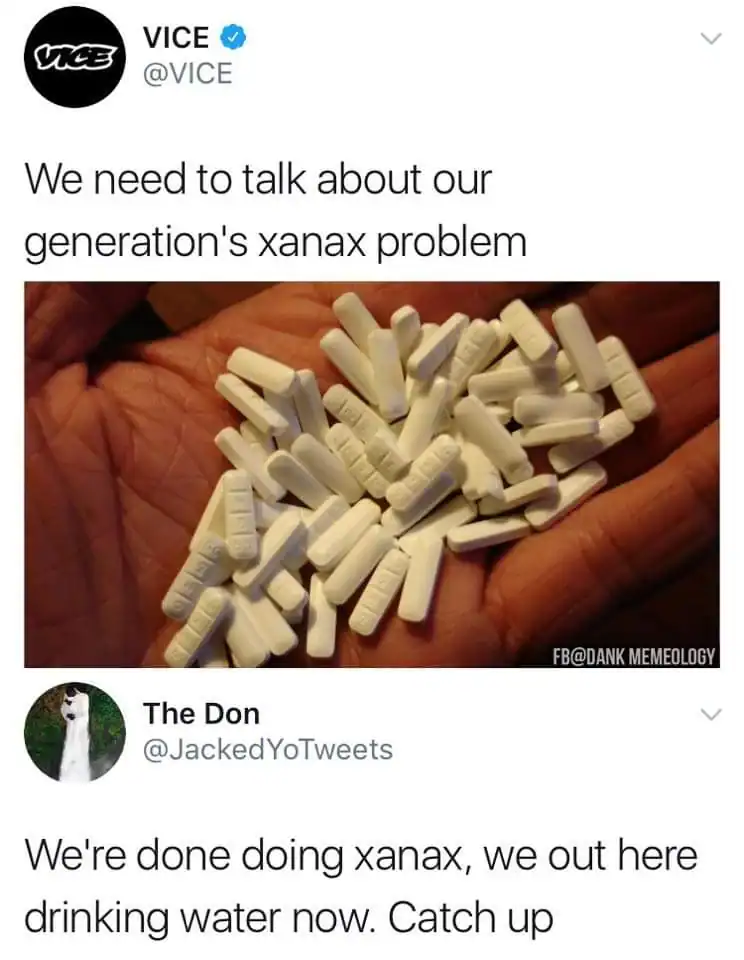 Close-up of white Xanax pills held in hand, symbolizing medication for anxiety.