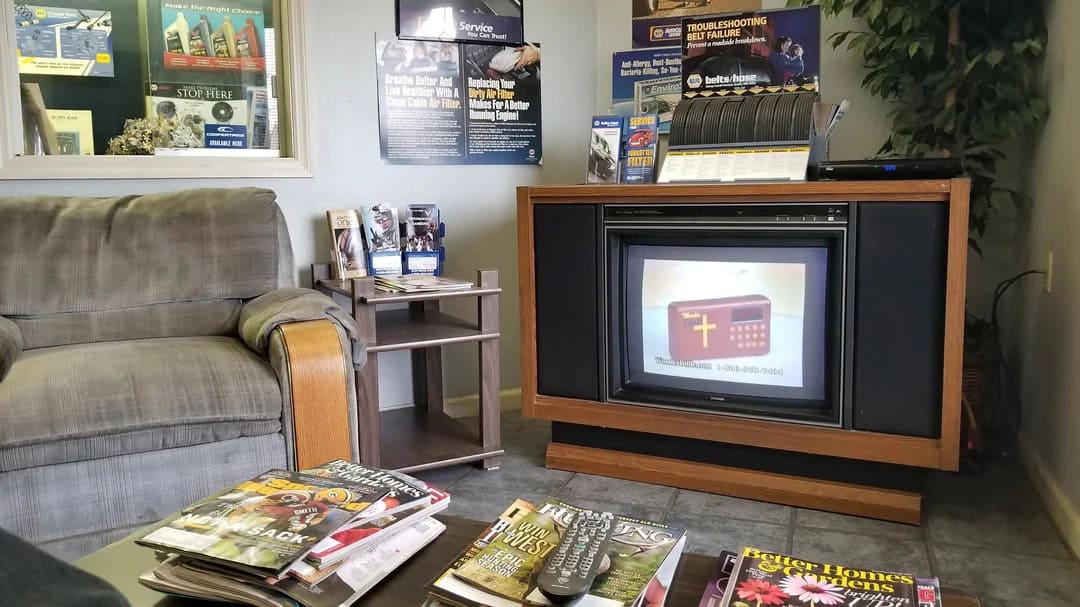 TV showing a digital cross and prayer card image.