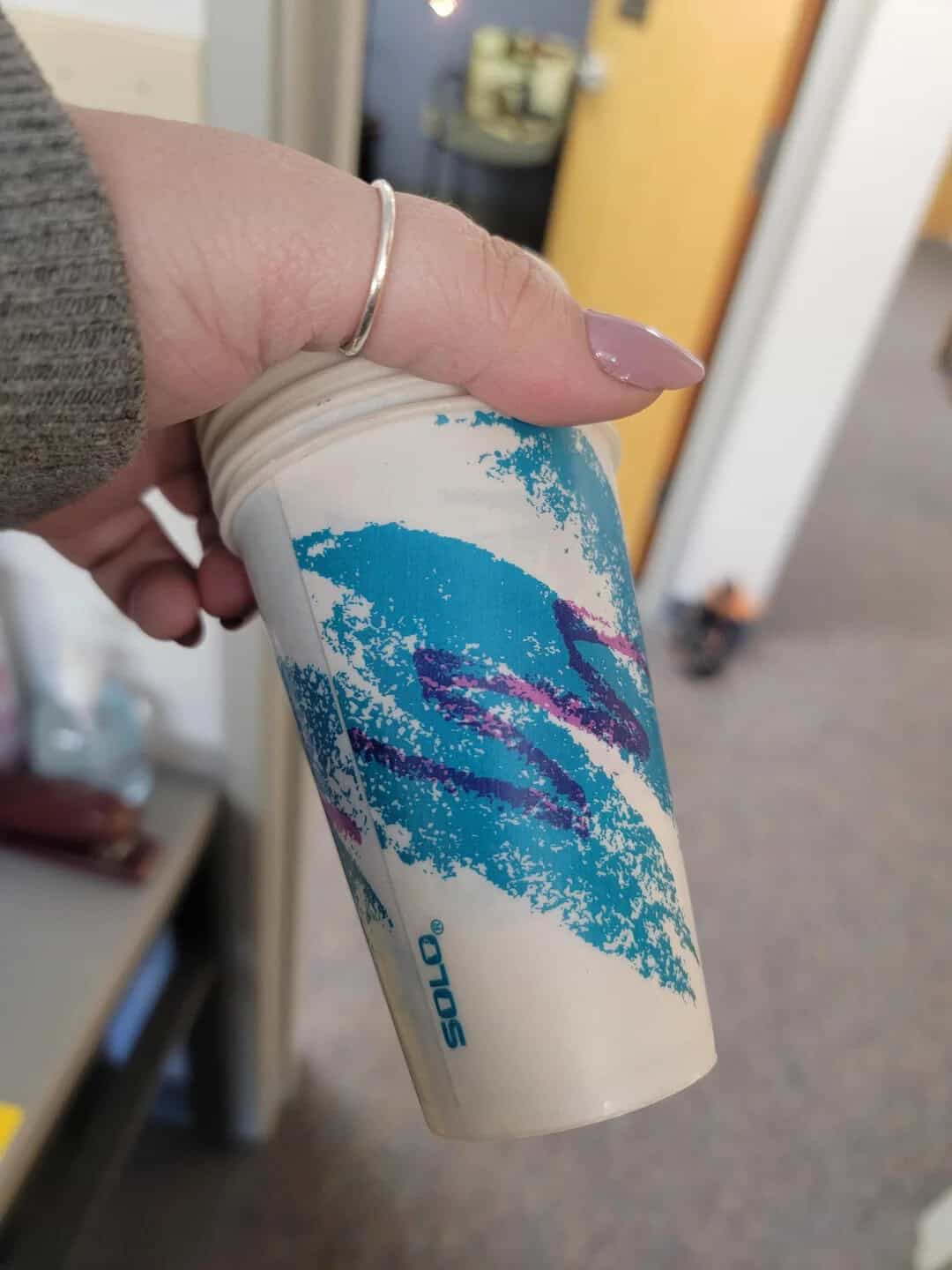 Brightly designed Solo coffee cup featuring an abstract blue and purple pattern.