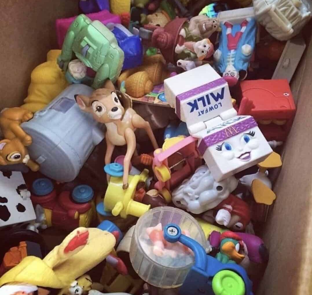 Vibrant assortment of toy characters and playsets, including animals, vehicles, and action figures,.