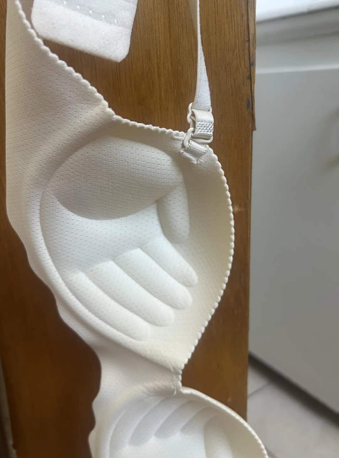White bra with hand-shaped padding for support and comfort.