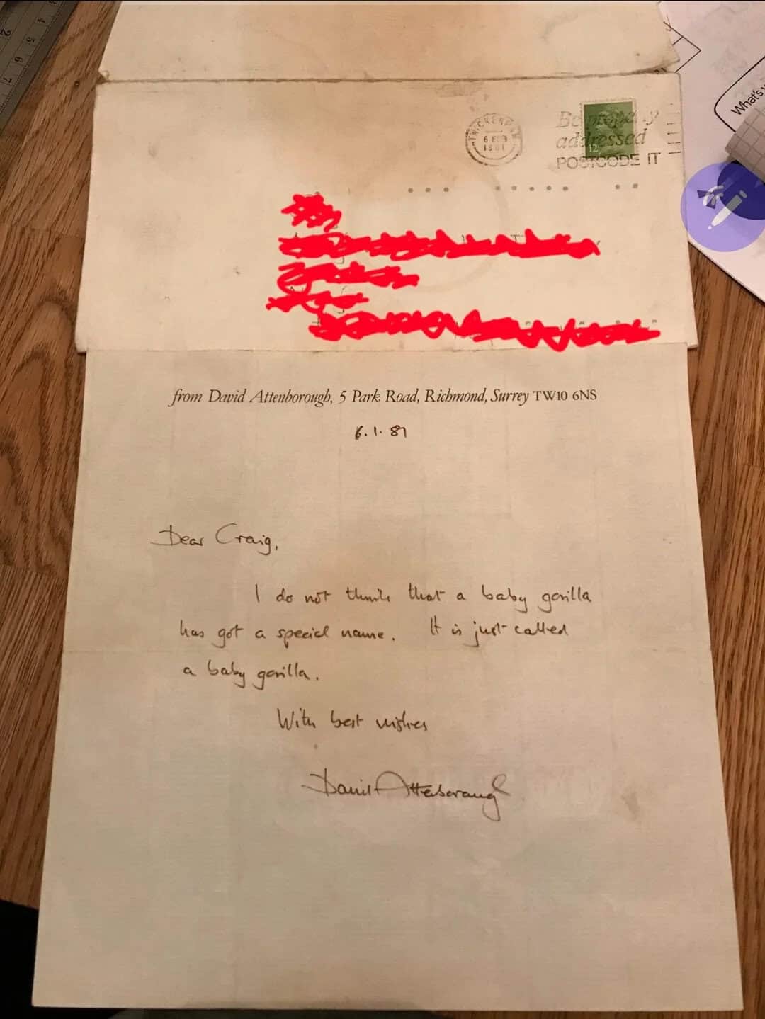 Image of a handwritten letter from David Attenborough about a baby gorilla, with redacted address de.