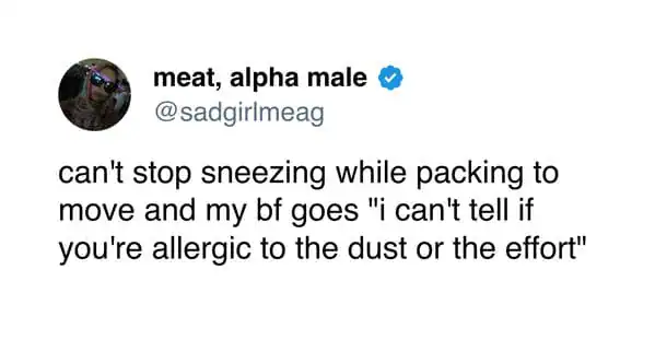 Person sneezing while packing, showing humor and travel chaos.
