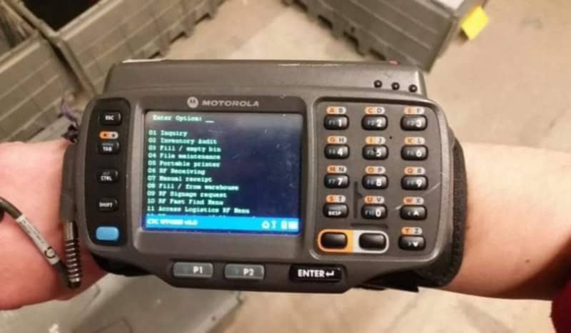 Handheld Motorola radio with digital display and keypad.