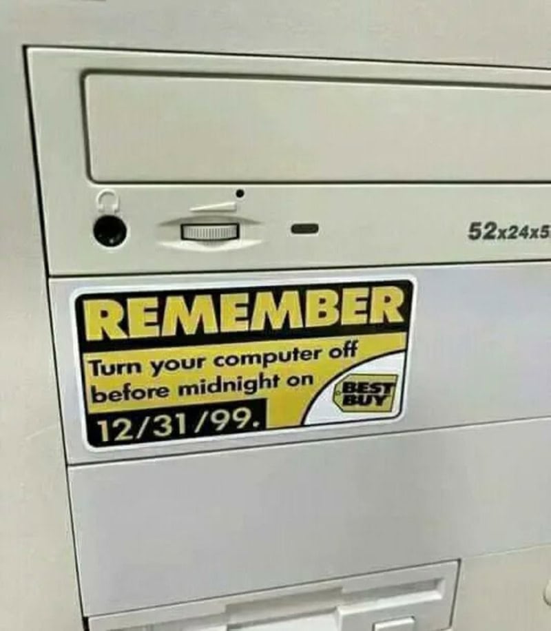 Computer shutdown reminder sticker on a white appliance, emphasizing turning off the computer before.