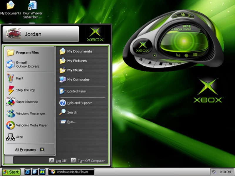 Xbox gaming console with green lighting and interface elements.