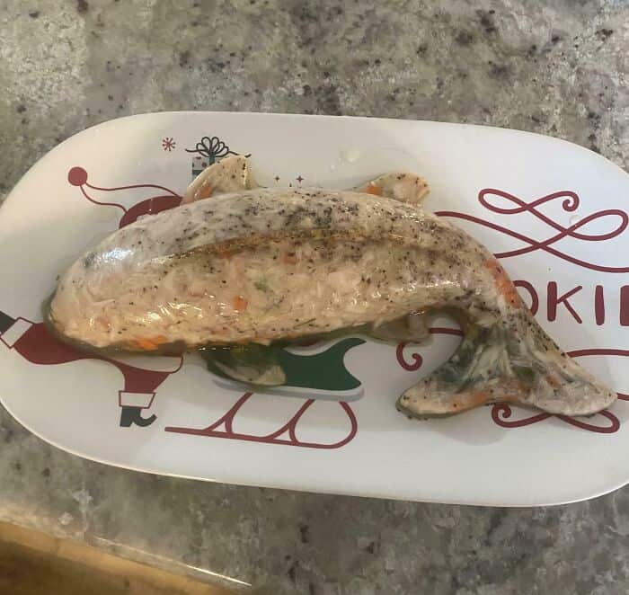 Unusual, slimy fish with a strange texture on a festive plate.