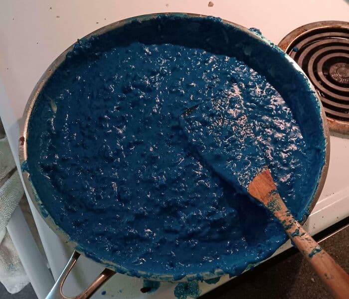 Blue food dye in a pan, resembling a "cursed food" concept for a humorous or spooky theme.