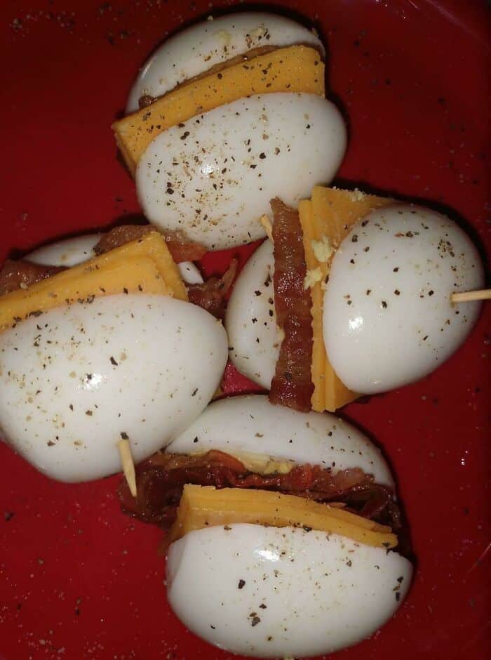 Mini cheese and bacon skewers with mozzarella, cheddar, and crispy bacon strips. Perfect for a quirk.