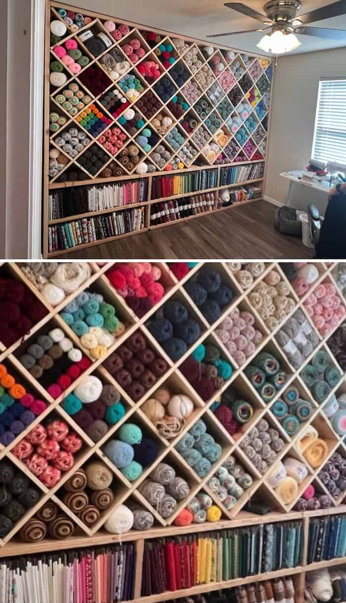 Yarn storage wall with colorful yarn skeins and knitting supplies, perfect for an organized craft ro.