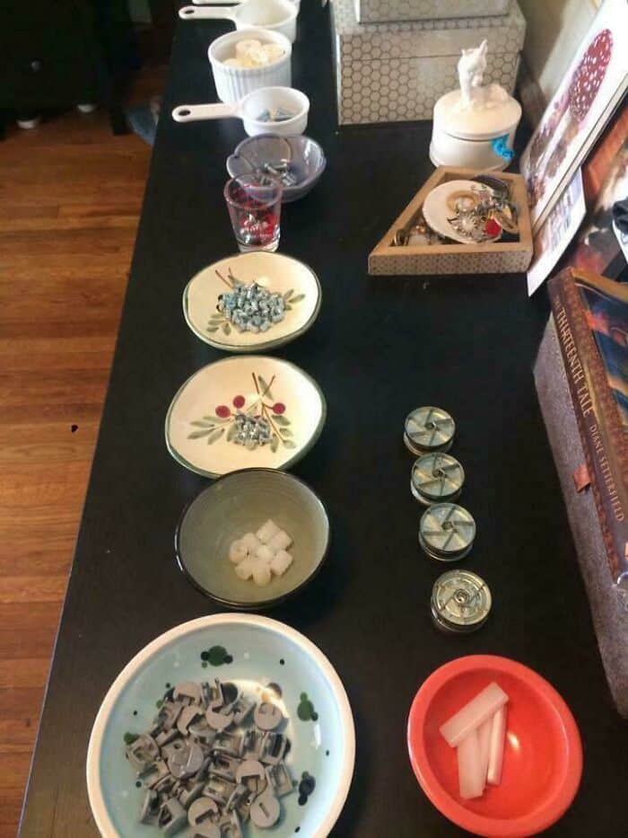 Neatly arranged table with pills, containers, and small objects for organization.