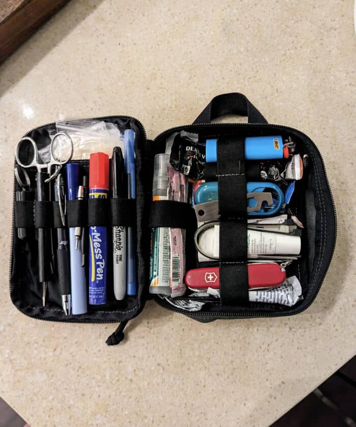 Compact first aid kit with medical supplies for organized emergency preparedness.