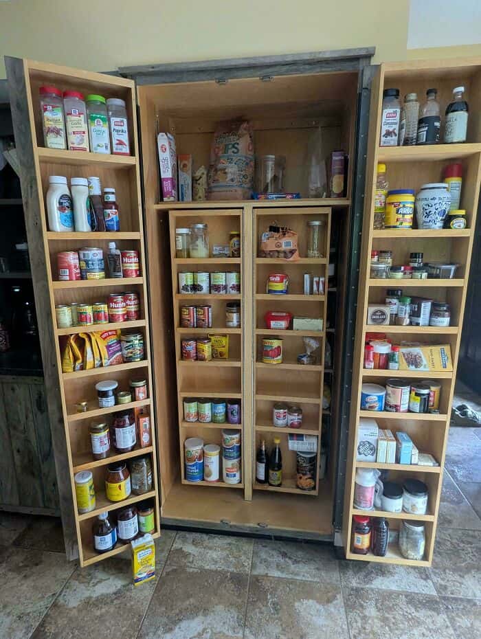 Organized pantry with labeled jars and containers for easy access and storage.