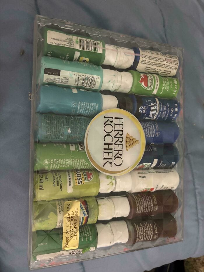 Toothpaste tubes and dental care products neatly arranged in a clear plastic organizer.