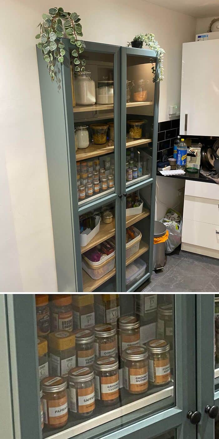 Well-organized kitchen cabinet with spices and jars for easy access.