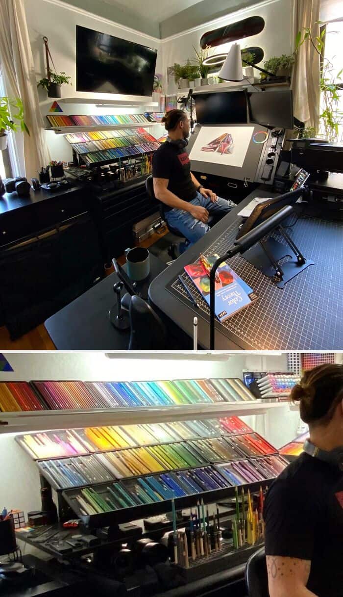 Artist working at a digital drawing tablet in a well-organized art studio with colorful supplies.