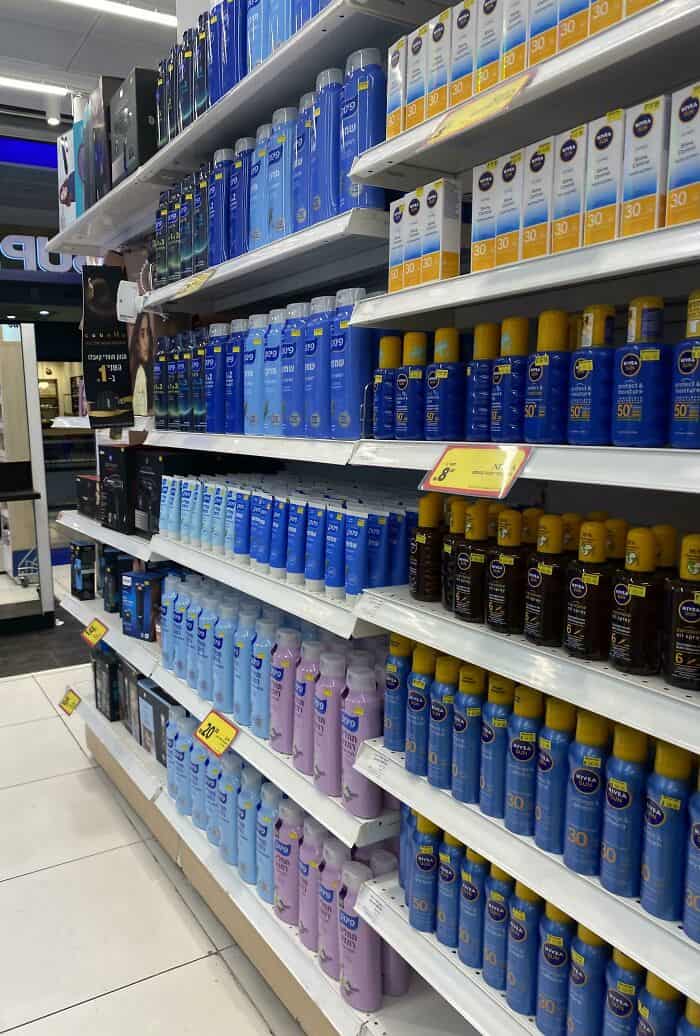 Well-organized shelves with skincare products in a retail store.