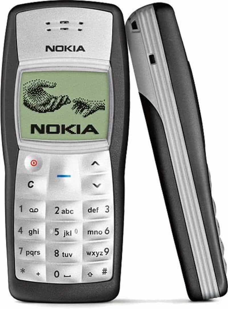 Nokia mobile phone with a green screen displaying a hand icon and the Nokia logo.