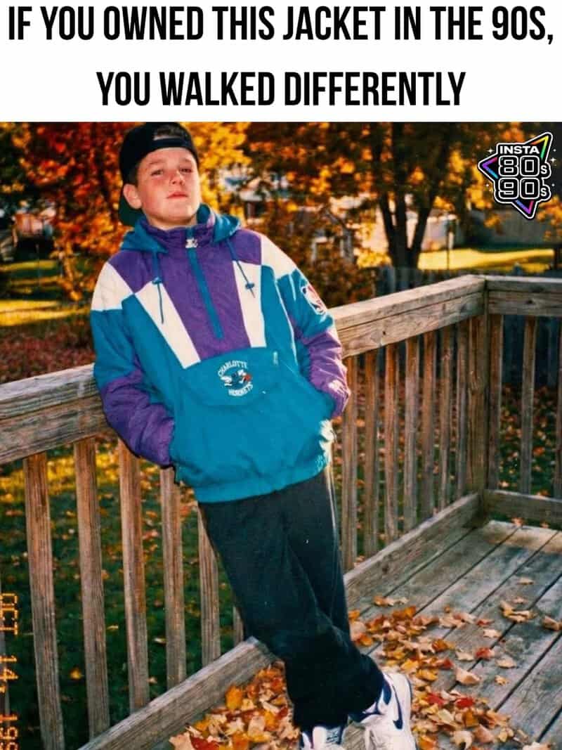 Man wearing a 90s style windbreaker jacket outdoors during autumn.