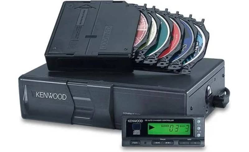 Kenwood CD player with multiple CDs loaded, digital control panel, and display screen.