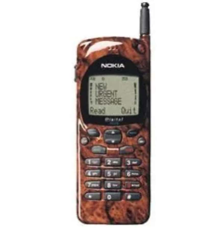 Nokia mobile phone with a brown marble pattern and antenna, displaying a message on the screen.