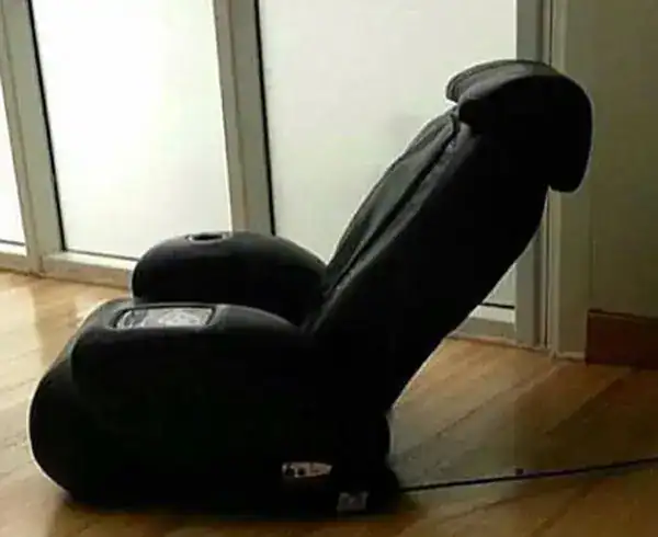 Relaxing massage chair with footrest for comfort and relaxation.