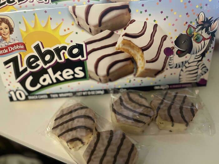 Zebra Cakes snack box with three individually wrapped cakes and a cartoon zebra illustration.