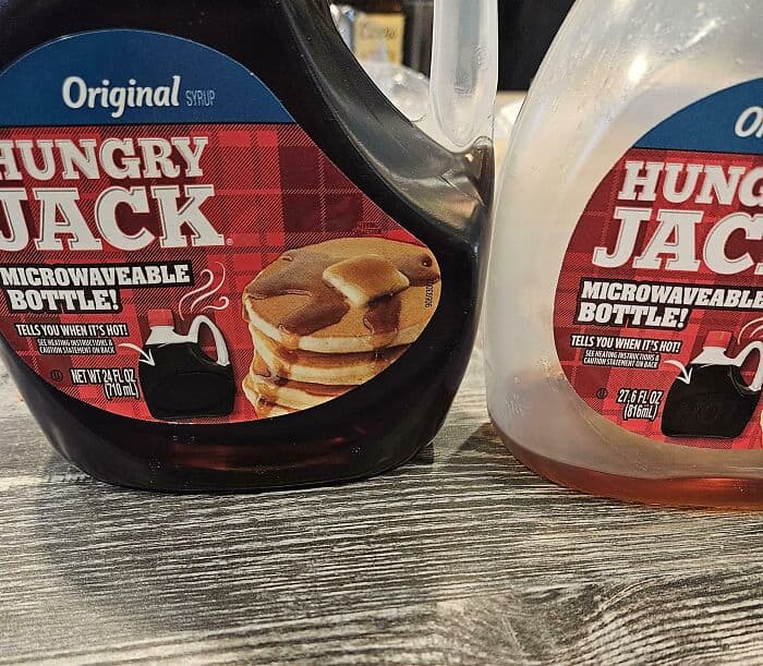 Microwaveable Hungry Jack syrup bottles with pancake stack image.