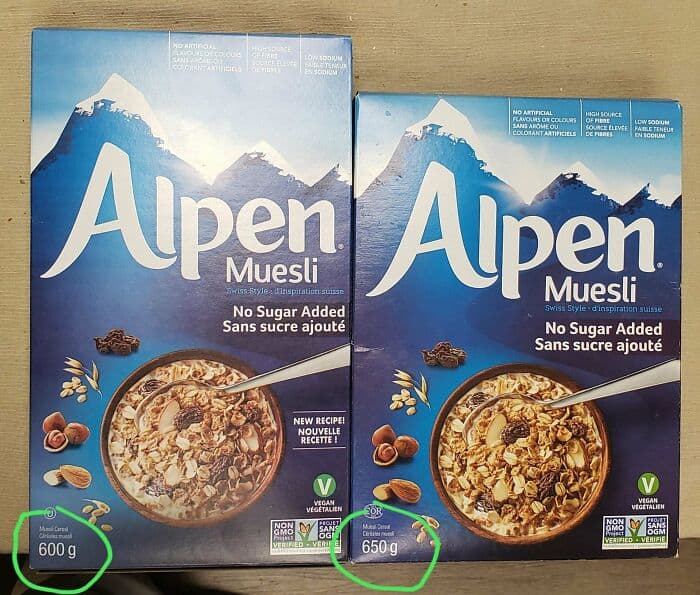 Alpen Muesli cereal boxes with mountain logo, one labeled 600g and the other 650g, featuring a bowl.