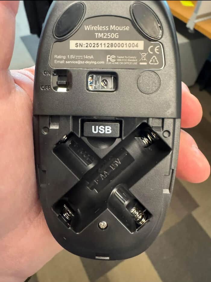 Wireless Mouse TM250G with battery compartment and USB receiver.