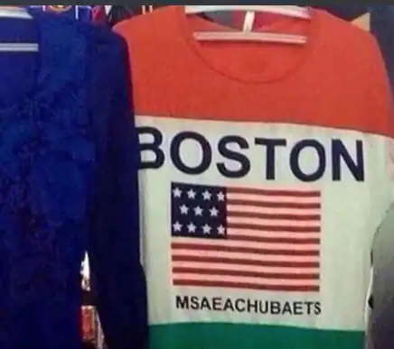 T-shirt with "BOSTON" and American flag, misspelled "MSAEACHUBAETS".