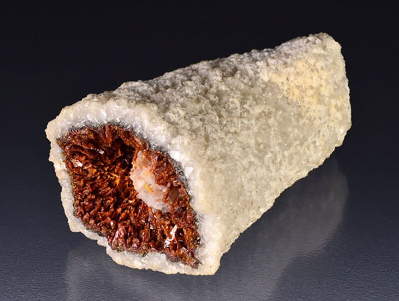 Delicious fried ice cream roll coated with crispy sugar crystals, showcasing a sweet dessert treat.