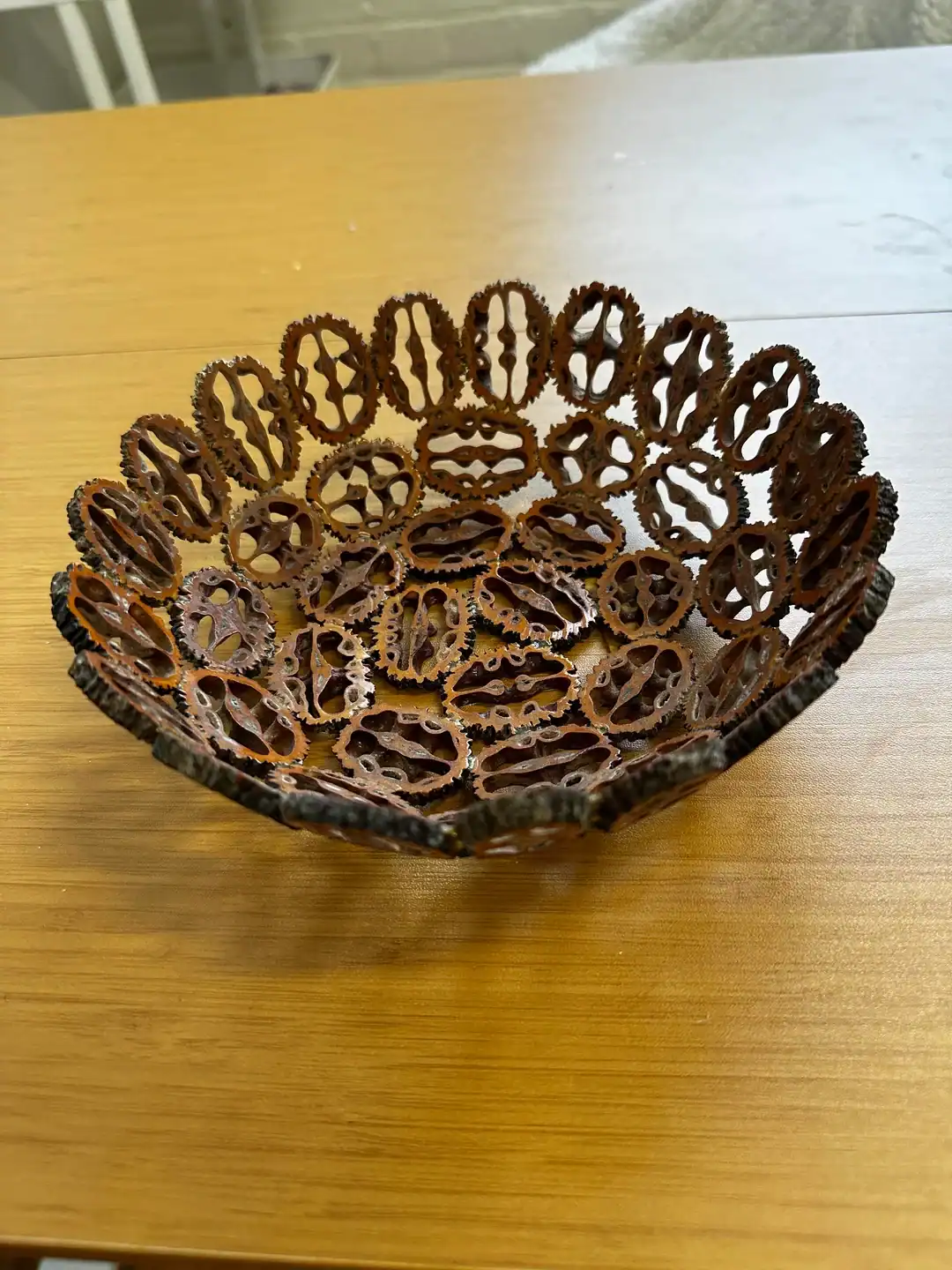 Vintage metal chain link bowl for decorative or functional use.
