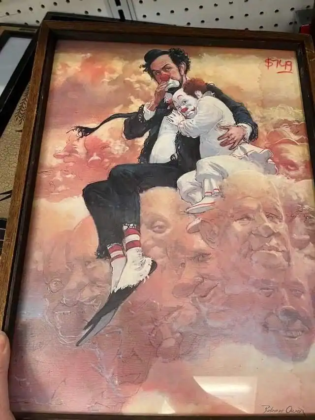 Clown painting featuring a man and a girl on a cloud with multiple faces in the background.